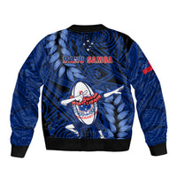 Unisex blue bomber jacket with MANU SAMOA lettering and rugby dabbing graphic.