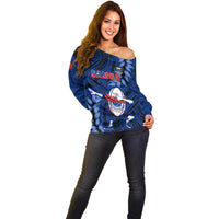 Women’s blue off-shoulder rugby sweater with Samoa crest and dabbing mascot graphic
