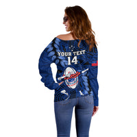 Women’s blue off-shoulder rugby sweater, back view with "YOUR TEXT 14" and flag patch