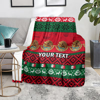 Red and green Mexican-style Christmas blanket with custom text across the center
