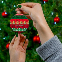 Personalized Mexico Christmas ceramic ornament, round disc with red green pattern held in hands