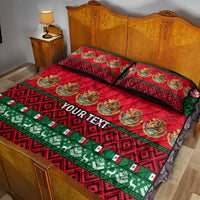 Personalized Christmas quilt bed set in red and green with dark geometric border; two pillowcases