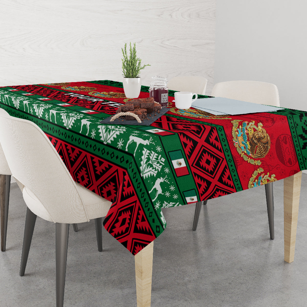 Red, green, and black Mexican Christmas tablecloth on dining table with chairs