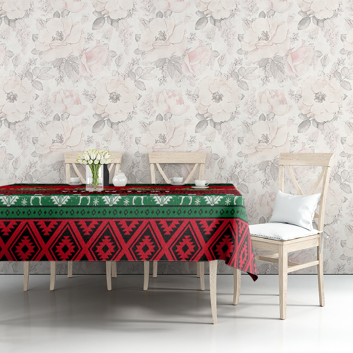 Red and green Mexican Christmas tablecloth with geometric bands on dining table