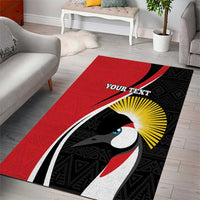 Red area rug with black geometric pattern, bird illustration and 'YOUR TEXT' banner