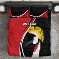 Red and black bedding set close-up with penguin logo artwork and tribal pattern