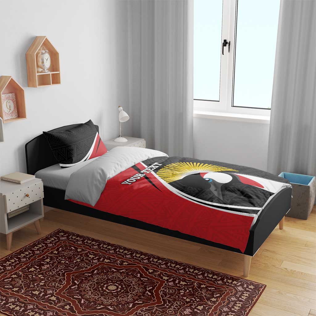 Red and black bedspread with large penguin graphic and geometric tribal pillow trim