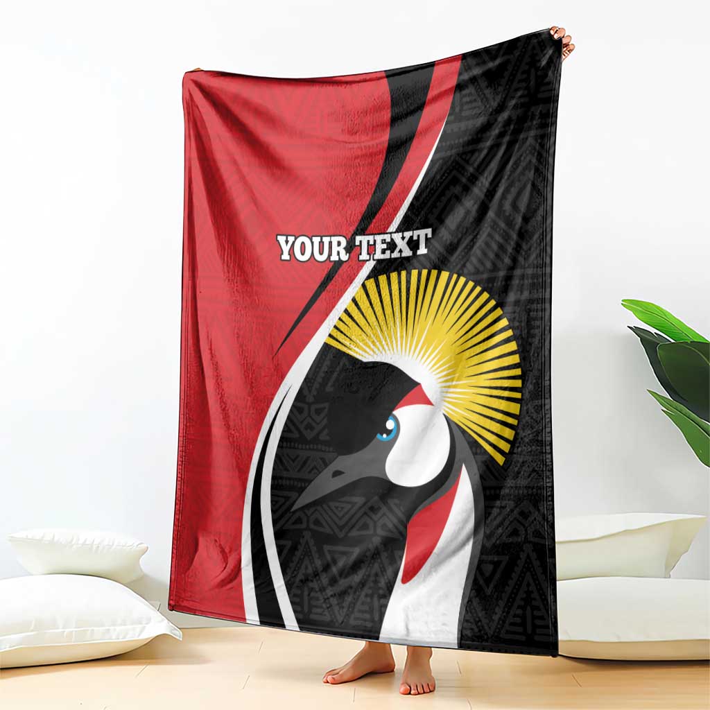 Red and black custom blanket hanging display, showing white mask face graphic and yellow sunburst