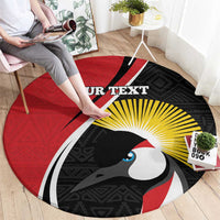 Round red rug with black/yellow bird graphic and 'YOUR TEXT' center