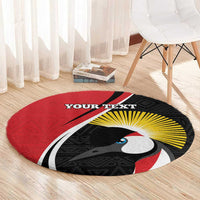 Round red rug with bird graphic, black rays and 'YOUR TEXT' near upper center