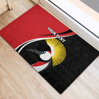 Red and black custom rubber doormat with bird emblem, yellow rays, and centered YOUR TEXT