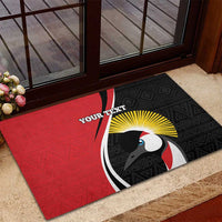 Red and black custom rubber doormat featuring bird emblem and YOUR TEXT with yellow rays