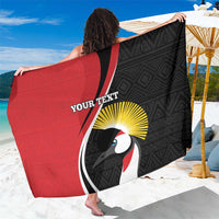 Red and black custom rugby sarong with geometric pattern and toucan artwork