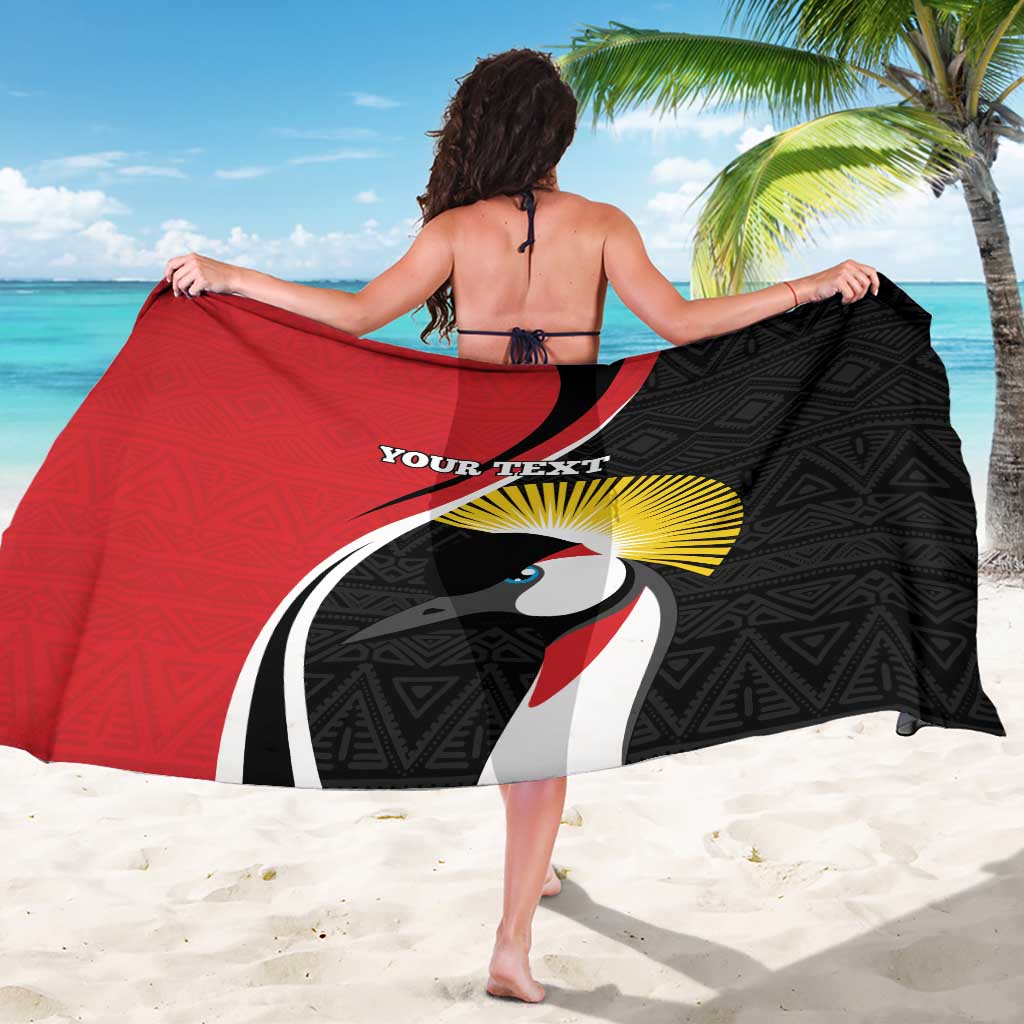 Red and black custom sarong with toucan face graphic, sunburst and geometric trim