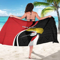 Red and black custom sarong with toucan face graphic, sunburst and geometric trim