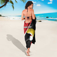Red and black custom sarong wrap skirt with toucan sunburst print and geometric pattern