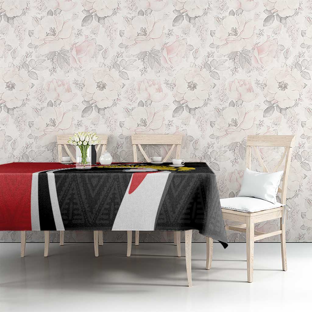 Tablecloth with black geometric pattern and crane emblem, with red border edge