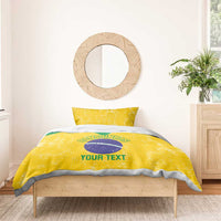 Yellow bedding set with Brazil emblem on duvet and 2 matching pillowcases