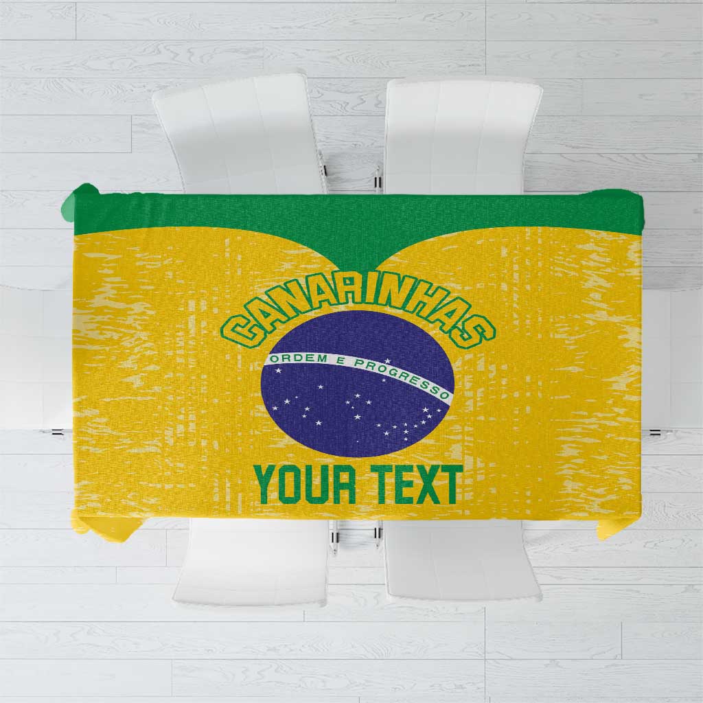 Yellow custom tablecloth flat lay with green border and circular text logo
