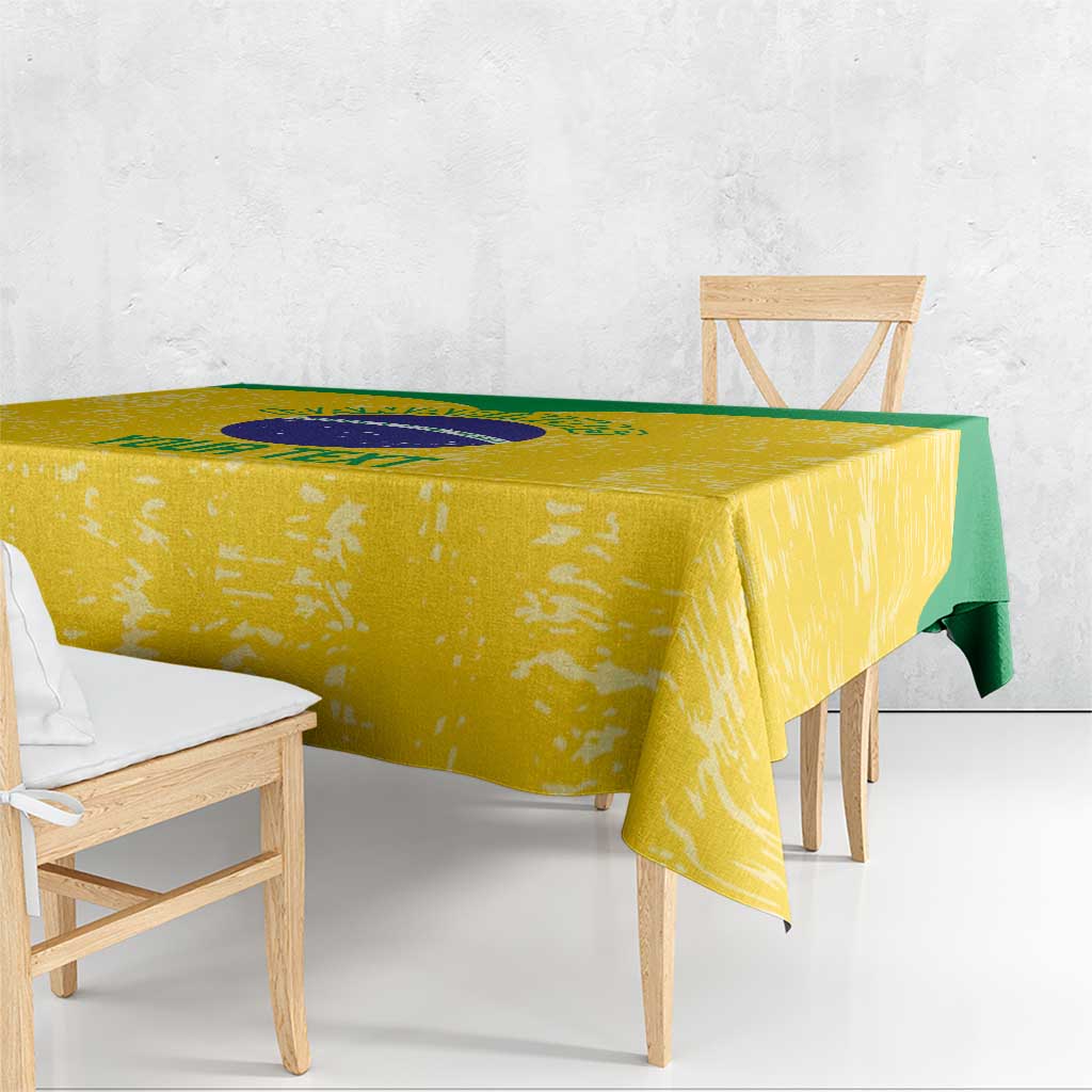 Yellow volleyball tablecloth draped on table with circular emblem and green side stripe