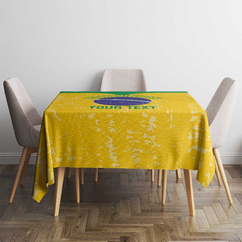 Yellow volleyball tablecloth on square table with circular emblem and four draping edges