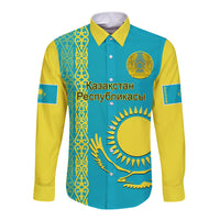 Blue long-sleeve button shirt with gold traditional pattern and crest on front