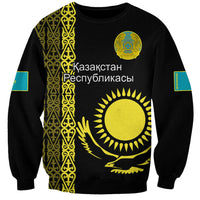 Black unisex sweatshirt with gold and turquoise Kazakh-style pattern panel and sun emblem