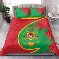 Cape Verde bedding set on bed: red duvet, green pillow covers, coat of arms emblem