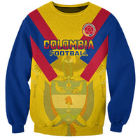 Kids' football sweatshirt, blue with yellow/red V stripes and crest graphic