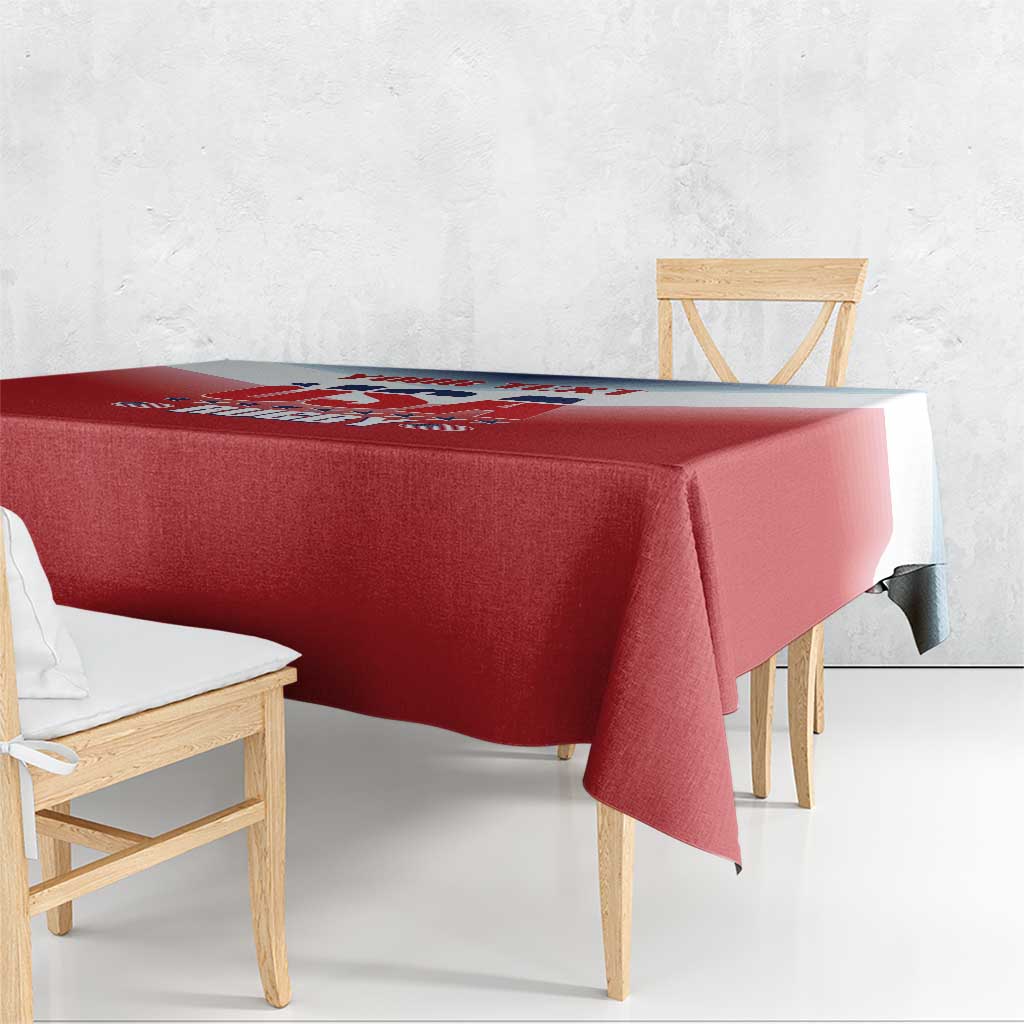 Red tablecloth draped over a rectangular table with a folded corner