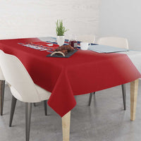 Red rugby-themed tablecloth with logo panel on a dining table