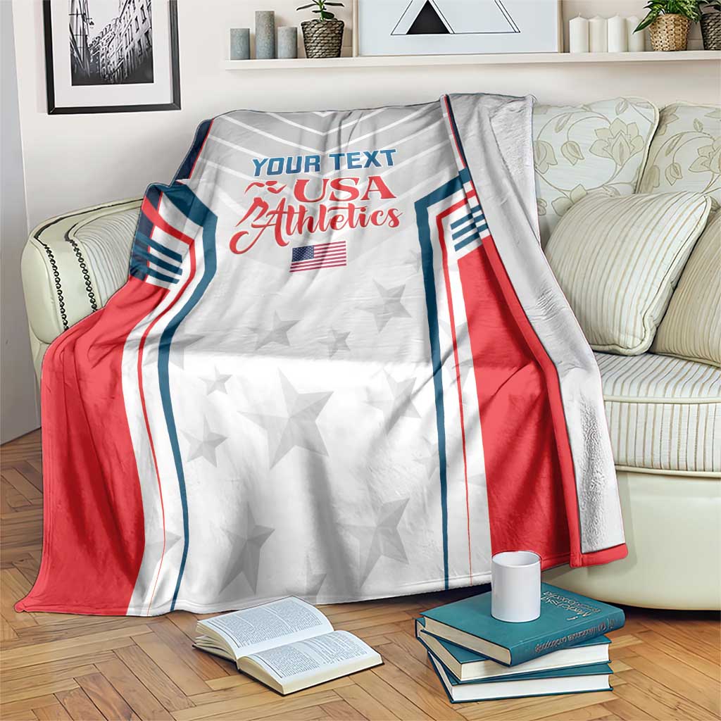 USA Athletics blanket draped on a couch, featuring 'YOUR TEXT', USA Athletics text, stars
