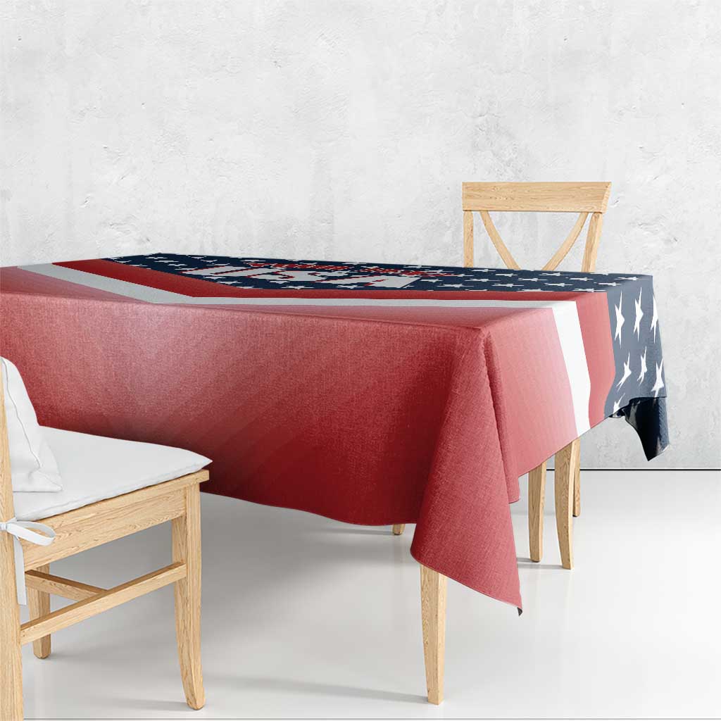 Red tablecloth with U.S. flag stars and stripes design, draped over a table