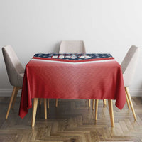 Red tablecloth with U.S. flag design stripe across the center on a square table