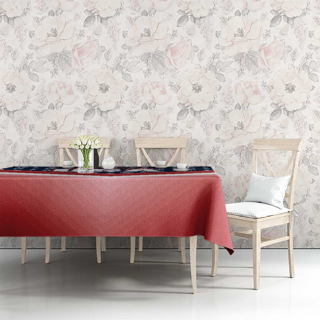 Red U.S. flag tablecloth with blue stars section, draped across a dining table