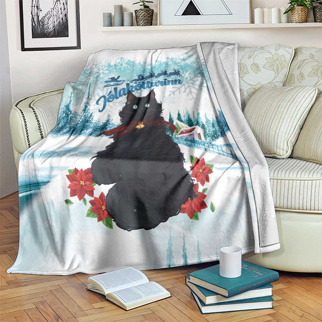 Blue and white Christmas cat blanket with winter landscape, poinsettias, and pine trees