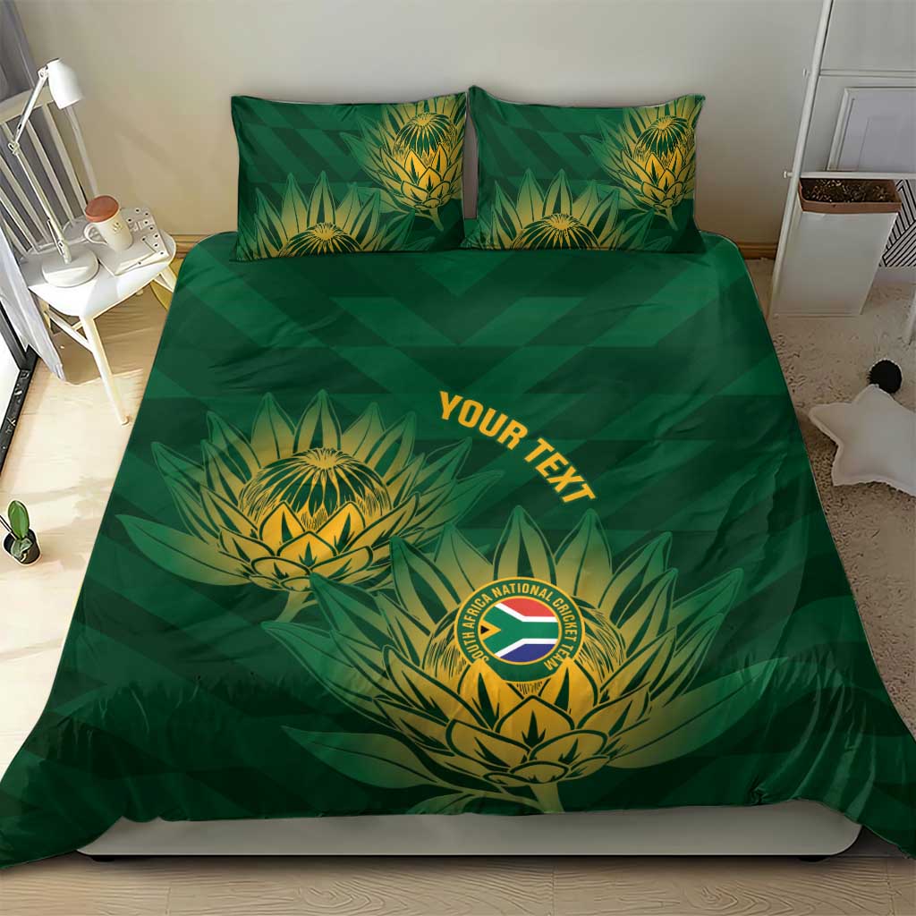 Green duvet cover and two matching pillows with gold crest and 'YOUR TEXT' design