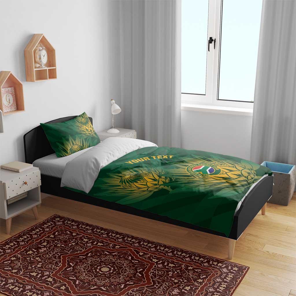 Green duvet cover with gold crest and 'YOUR TEXT' print, matching pillowcase set
