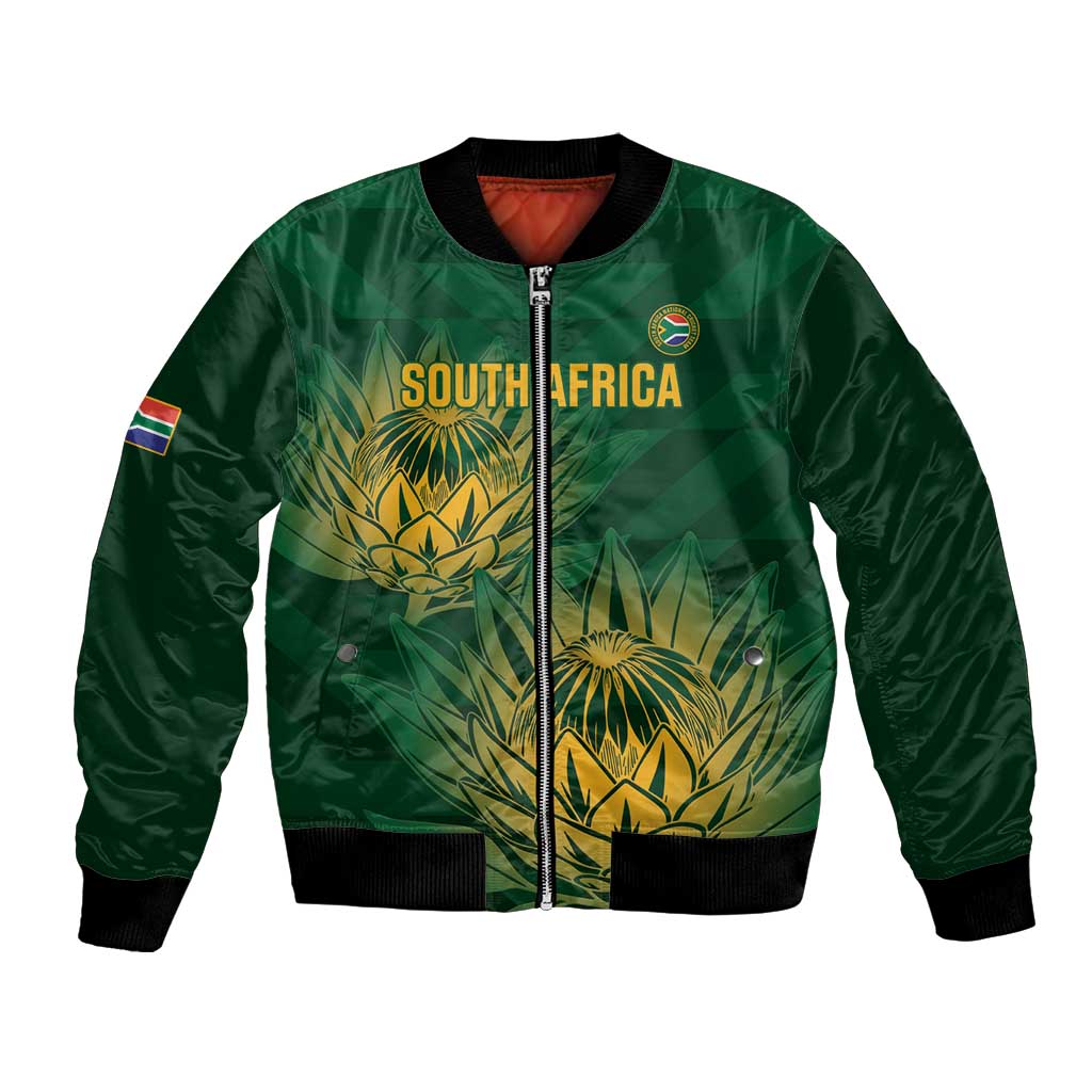Green cricket bomber jacket with front zip, ribbed cuffs, and gold crest graphic