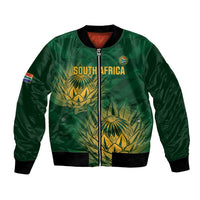 Green cricket bomber jacket with front zip, ribbed cuffs, and gold crest graphic