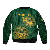 Green cricket bomber jacket with back graphic, 'YOUR TEXT 14', and ribbed hem