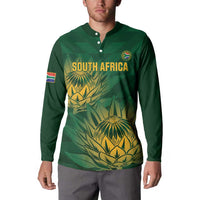 Green button sweatshirt with South Africa logo text and yellow palm print