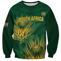 Green crewneck cricket sweatshirt with South Africa graphic and Proteas emblem