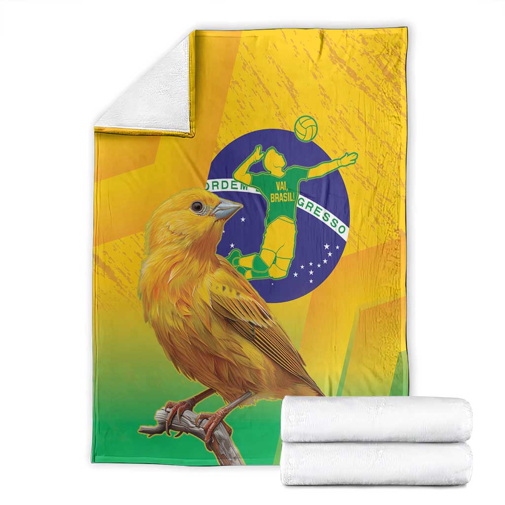 Yellow green blue volleyball blanket with bird and Brazil emblem, folded with stacked towels