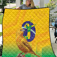 Yellow and green Brasil volleyball quilt close-up with bird graphic on diamond-quilted fabric
