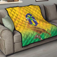 Yellow and green Brasil volleyball quilt on a sofa, featuring bird graphic and diamond quilting