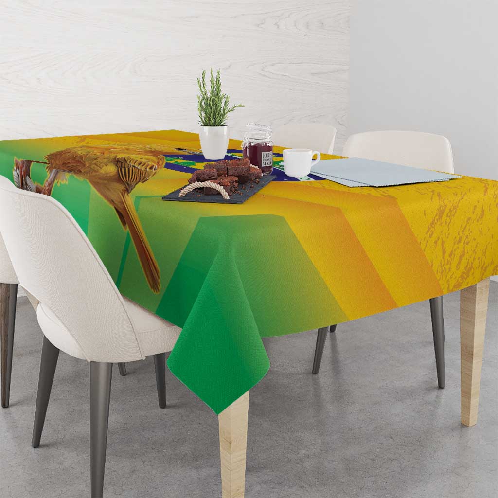 Yellow and green printed volleyball tablecloth with bird and globe motif, corner drape.