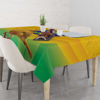Yellow and green printed volleyball tablecloth with bird and globe motif, corner drape.
