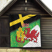Welsh dragon quilt displayed on railing: green, yellow cross, red dragon, black and white.