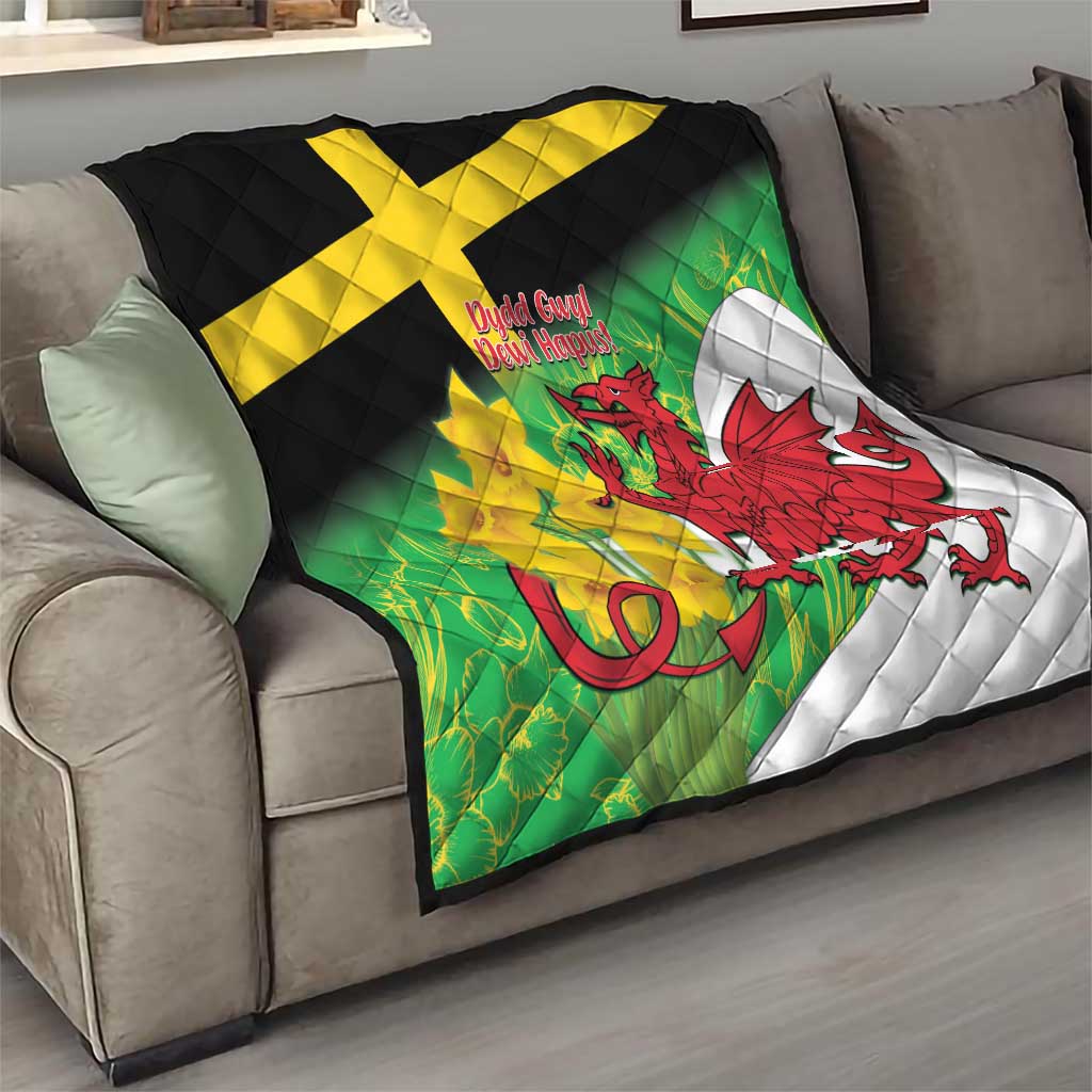 Welsh dragon quilt draped on sofa with green background, yellow cross, red dragon and white panel.